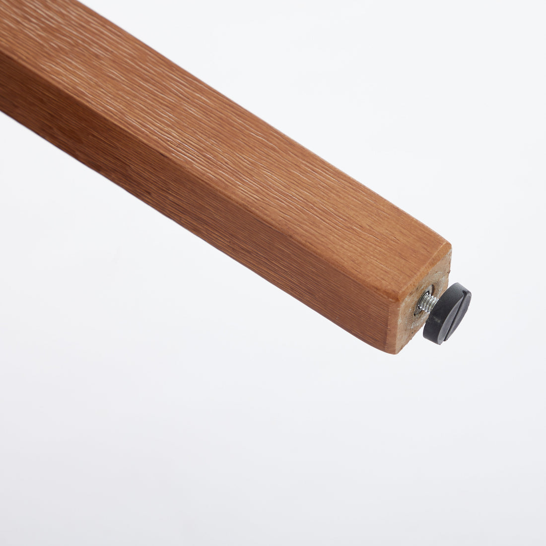 Yukon white dining chair close-up of the solid rubberwood leg with floor protector