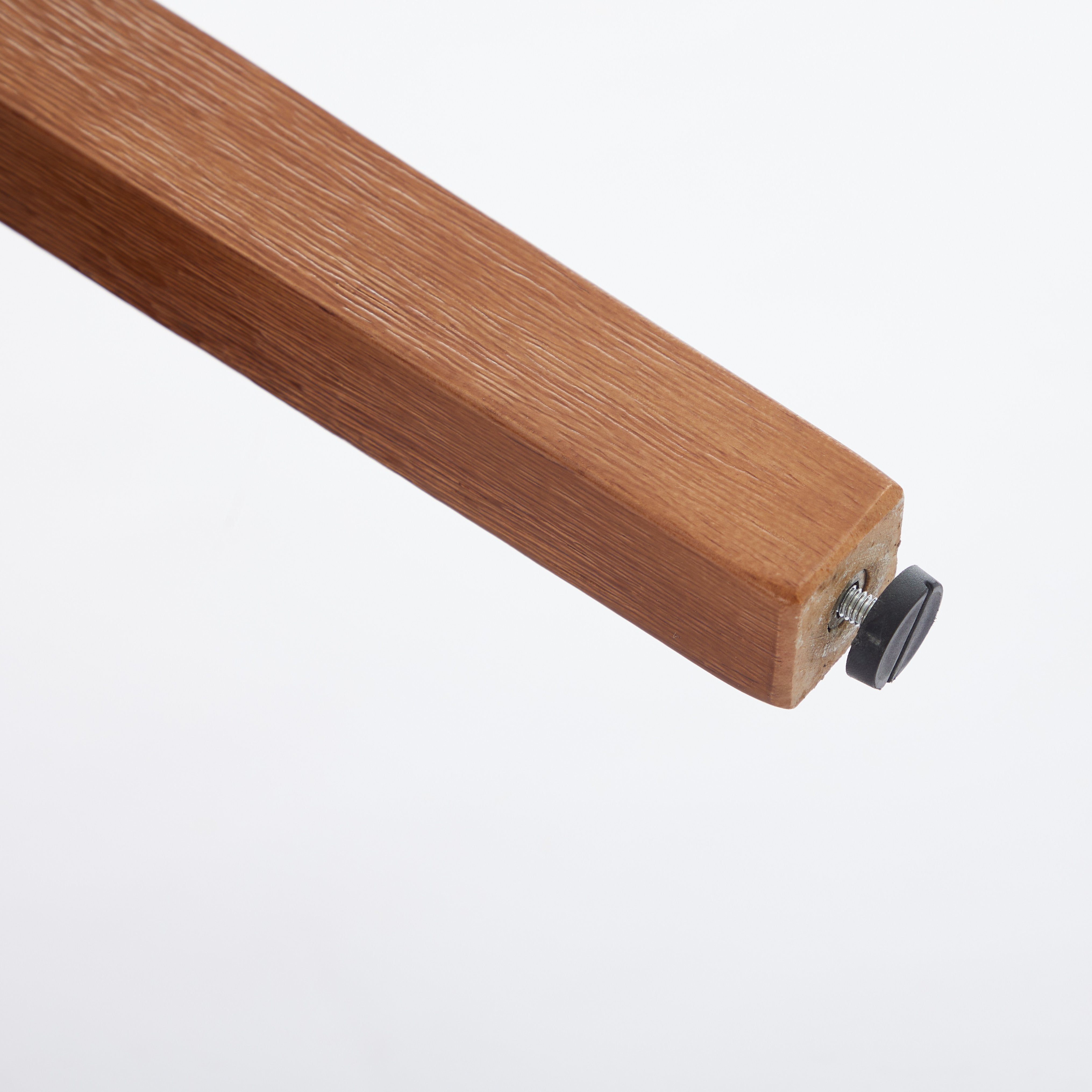 Yukon white dining chair close-up of the solid rubberwood leg with floor protector