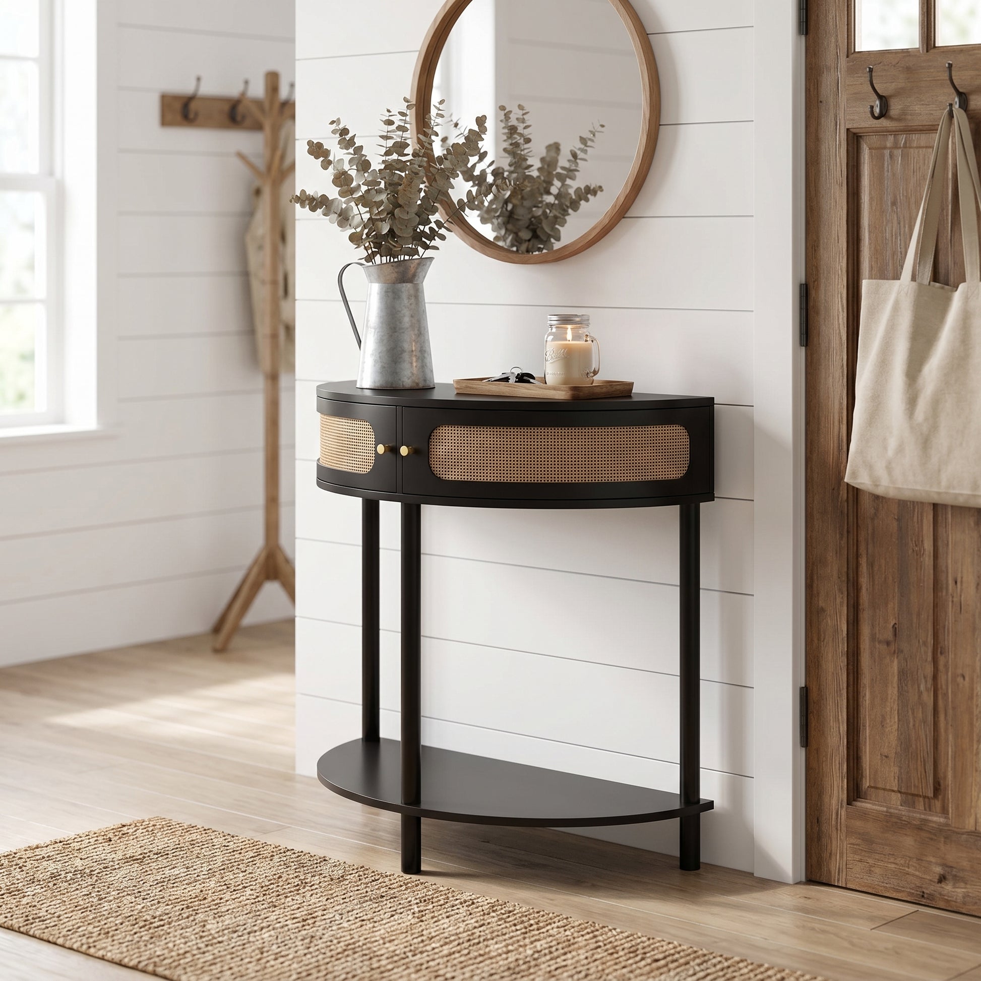 Saint black console table showing a styled corner scene with mirror and decorative accents